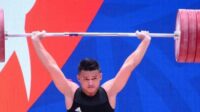 Rizki Juniansyah, atlet angkat besi Banten menambah perolehan medali emas Kontingen Banten di Pekan Olahraga Nasional Papua Kamis, 7 Oktober 2021.